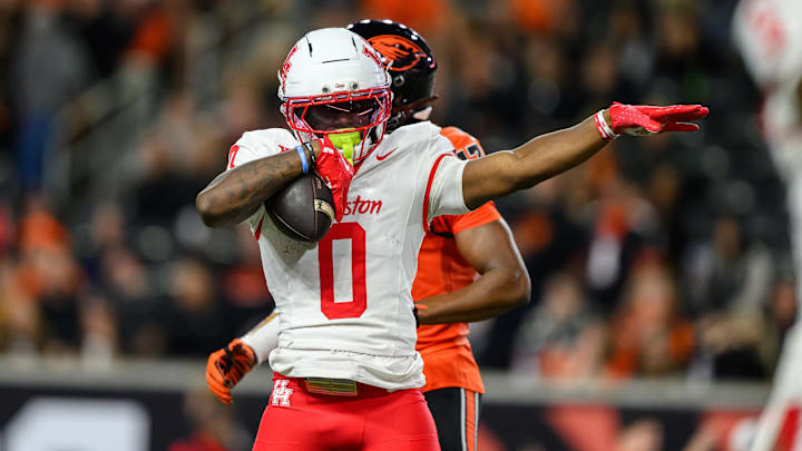 Sep 26, 2025; Corvallis, Oregon, USA; Houston Cougars wide receiver Amare Thomas (0) celebrates a catch and first down during the second quarter against the Oregon State Beavers at Reser Stadium. Mandatory Credit: Craig Strobeck-Imagn Images Sep 26, 2025; Corvallis, Oregon, USA; Houston Cougars wide receiver Amare Thomas (0) celebrates a catch and first down during the second quarter against the Oregon State Beavers at Reser Stadium. Mandatory Credit: Craig Strobeck-Imagn Images