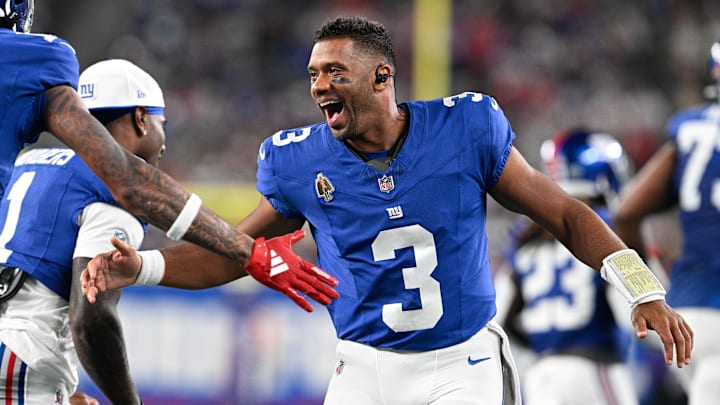 Aug 21, 2025; East Rutherford, New Jersey, USA; New York Giants quarterback Russell Wilson (3) celebrates a touchdown during the first quarter against the New England Patriots at MetLife Stadium. Mandatory Credit: Mark Smith-Imagn Images
