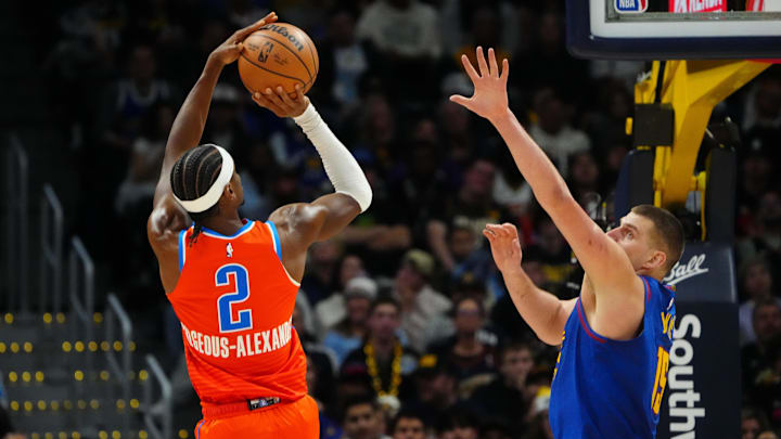 Dec 16, 2023; Denver, Colorado, USA; Oklahoma City Thunder guard Shai Gilgeous-Alexander (2) shoots the ball over Denver Nuggets center Nikola Jokic (15) in the fourth quarter at Ball Arena. Mandatory Credit: Ron Chenoy-Imagn Images Dec 16, 2023; Denver, Colorado, USA; Oklahoma City Thunder guard Shai Gilgeous-Alexander (2) shoots the ball over Denver Nuggets center Nikola Jokic (15) in the fourth quarter at Ball Arena. Mandatory Credit: Ron Chenoy-Imagn Images