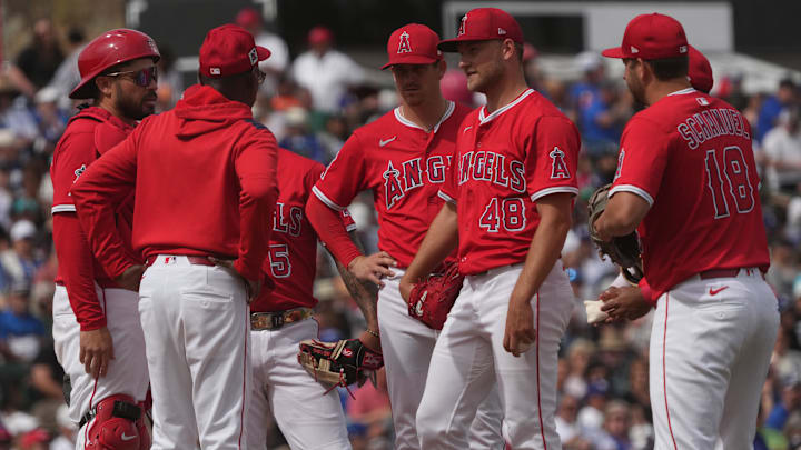 Mar 5, 2025; Tempe, Arizona, USA; Los Angeles Angels manager Ron Washington talks to pitcher Reid Detmers (48) in the third inning at Tempe Diablo Stadium. Mandatory Credit: Rick Scuteri-Imagn Images