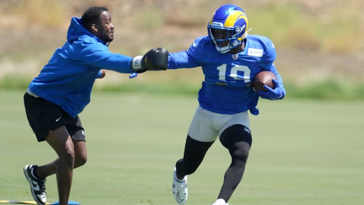 Bears new offensive coordinator Thomas Brown always had a hands-on approach with the Rams, as he shows here as tight ends coach working with Brandon Powell. 