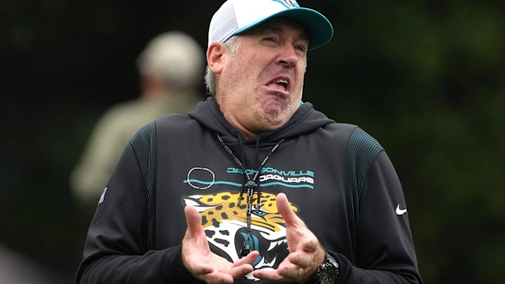 Oct 16, 2024; Watford, United Kingdom; Jacksonville Jaguars coach Doug Pederson reacts during practice at The Grove. Mandatory Credit: Kirby Lee-Imagn Images