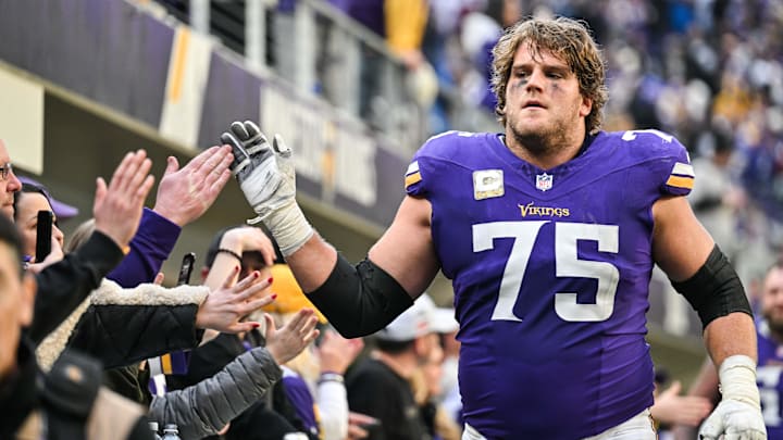 Dec 1, 2024; Minneapolis, Minnesota, USA; Minnesota Vikings offensive tackle Brian O'Neill (75) reacts with the crowd after the game against the Arizona Cardinals at U.S. Bank Stadium.