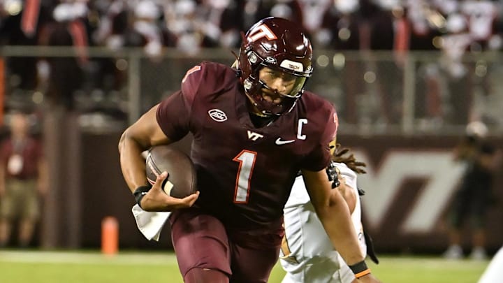 Sep 6, 2025; Blacksburg, Virginia, USA; Virginia Tech Hokies quarterback Kyron Drones (1) runs the ball during the second quarter at Lane Stadium. Mandatory Credit: Brian Bishop-Imagn Images