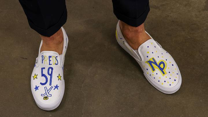 Nashville Predators' Roman Josi wears custom shoes designed by Caroline Lantz, a 13-year-old cancer patient.