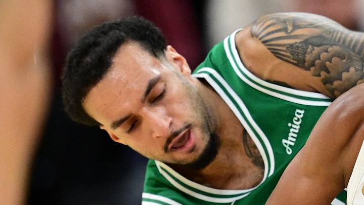 Oct 8, 2026; Cleveland, Ohio, USA;  Cleveland Cavaliers guard Meleek Thomas (15) protects the ball from Boston Celtics guard Devin Carter (99) during the second half of a preseason game at Rocket Arena.  Mandatory Credit: David Dermer-Imagn Images