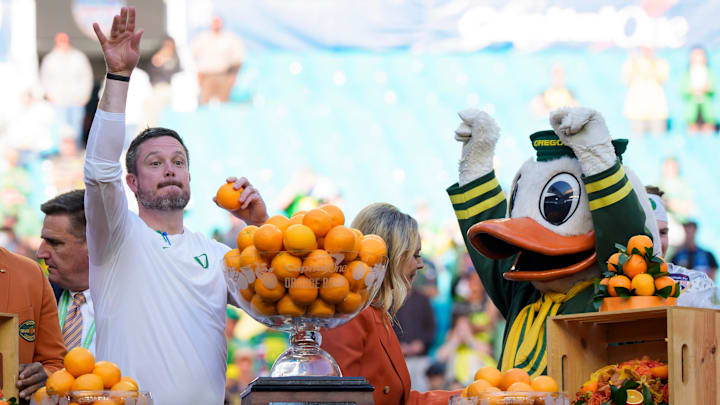 Oregon head coach Dan Lanning throws out oranges as the team celebrates its win as the Oregon Ducks take on the Texas Tech Red Raiders in the Orange Bowl on Jan. 1, 2026.
