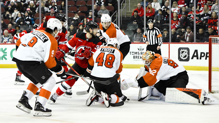 Jan 29, 2025; Newark, New Jersey, USA; Philadelphia Flyers goaltender Ivan Fedotov (82) makes a save against the New Jersey Devils during the third period at Prudential Center. Mandatory Credit: John Jones-Imagn Images