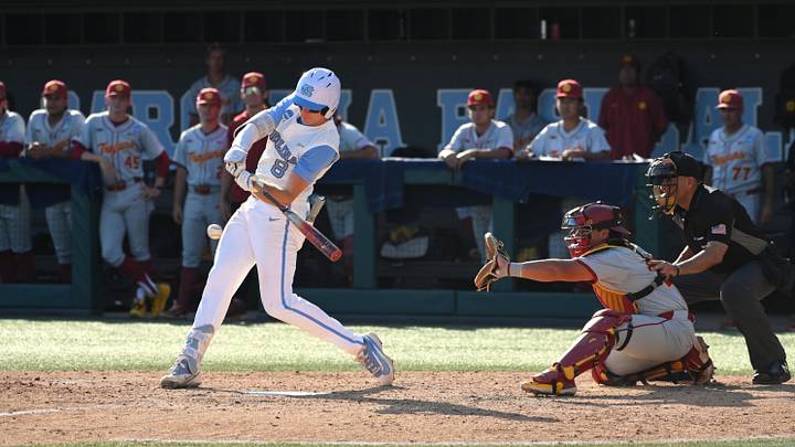 Jun 5, 2026; Chapel Hill, NC, USA;  North Carolina Tar Heels outfielder Owen Hull (8) hits the ball in the seventh inning agains the USC Trojans at Boshamer Stadium. Mandatory Credit: Zachary Taft-Imagn Images