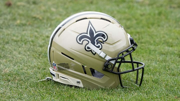 Aug 14, 2025; Carson, CA, USA; A New Orleans Saints helmet on the field during a joint practice against the Los Angeles Rams at the Dignity Health Sports Park. Mandatory Credit: Kirby Lee-Imagn Images
