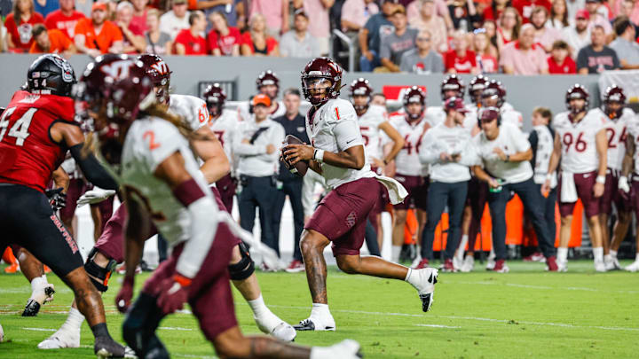 Sep 27, 2025; Raleigh, N.C.; Virginia Tech quarterback Kyron Drones (1) with the ball during the first half of the game against NC State. Sep 27, 2025; Raleigh, N.C.; Virginia Tech quarterback Kyron Drones (1) with the ball during the first half of the game against NC State.