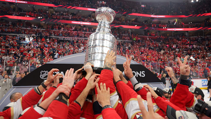 Jun 17, 2025; Sunrise, Florida, USA; The Florida Panthers hoist the Stanley Cup after winning game six of the 2025 Stanley Cup Final against the Edmonton Oilers at Amerant Bank Arena. Mandatory Credit: Sam Navarro-Imagn Images