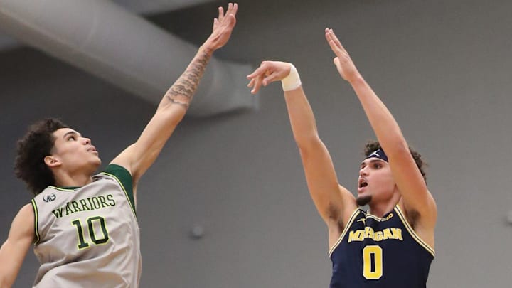 Michigan guard Adrian Nunez shoots against Wayne State forward Mike Robinson during the first half on Friday, Nov. 5, 2021 at the Wayne State University Fieldhouse.
Mich Wsu Michigan guard Adrian Nunez shoots against Wayne State forward Mike Robinson during the first half on Friday, Nov. 5, 2021 at the Wayne State University Fieldhouse.
Mich Wsu