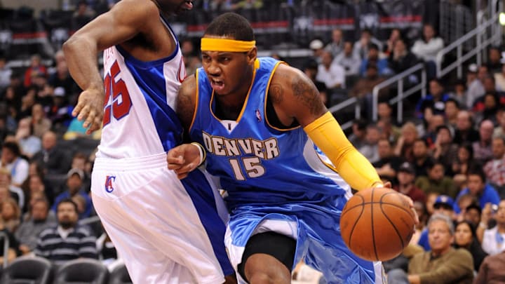 Nov 26, 2008; Los Angeles, CA, USA; Denver Nuggets forward Carmelo Anthony (15) dribbles past Los Angeles Clippers guard Mardy Collins (25) at the Staples Center. The Nuggets defeated the Clippers 106-105. Mandatory Credit: Kirby Lee/Image of Sport-Imagn Images