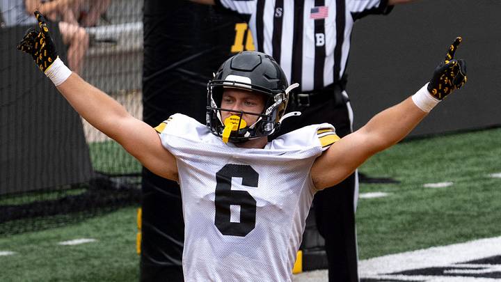 Iowa defensive back Zach Lutmer (6) makes the incomplete catch signal Aug. 15, 2026 during the Kids Day at Kinnick open practice at Kinnick Stadium in Iowa City, Iowa.