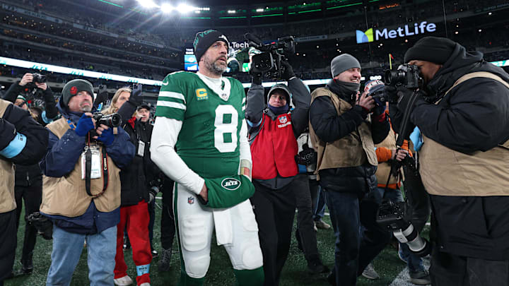 Jan 5, 2025; East Rutherford, New Jersey, USA; New York Jets quarterback Aaron Rodgers (8) walks on the field after the game against the Miami Dolphins at MetLife Stadium. Mandatory Credit: Vincent Carchietta-Imagn Images