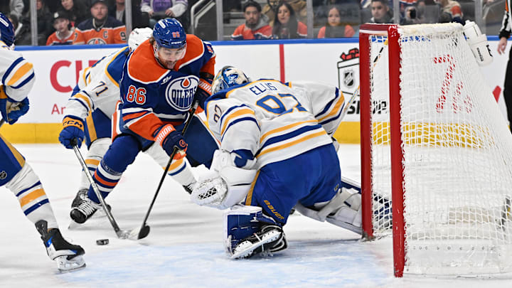 Dec 9, 2025; Edmonton, Alberta, CAN; Edmonton Oilers right winger David Tomasek 86) shoots the puck against  Buffalo Sabres goalie Colten Ellis (92) during the first period at Rogers Place. Mandatory Credit: Walter Tychnowicz-Imagn Images