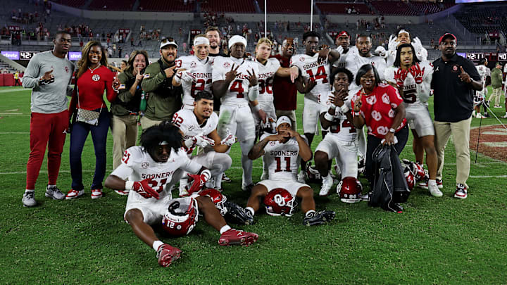 Oklahoma players settled for a photo just outside of the midfield logo on Saturday evening.