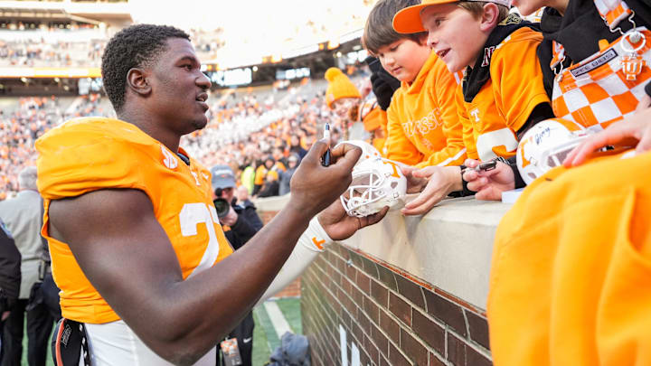 Tennessee defensive lineman James Pearce Jr. autographs items for children after a college football game between Tennessee and UTEP at Neyland Stadium in Knoxville, Tennessee, on Saturday, Nov. 23, 2024.
