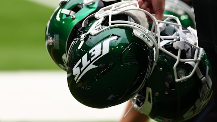 Oct 6, 2024; Tottenham, ENG; New York Jets helmets are held by staff before the match against Minnesota Vikings at Tottenham Hotspur Stadium. Mandatory Credit: Shaun Brooks-Imagn Images