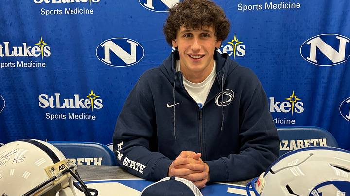 Penn State quarterback commit Peyton Falzone of Nazareth (Pa.) High at his Signing Day ceremony with Penn State and Nazareth helmets. Penn State quarterback commit Peyton Falzone of Nazareth (Pa.) High at his Signing Day ceremony with Penn State and Nazareth helmets.