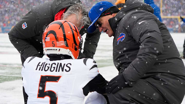 Dec 7, 2025; Orchard Park, New York, USA; Cincinnati Bengals wide receiver Tee Higgins (5) is attended to by medical staff in the second quarter against the Buffalo Bills at Highmark Stadium. Mandatory Credit: Gregory Fisher-Imagn Images