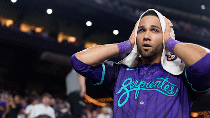 Aug 22, 2025; Phoenix, Arizona, USA; Arizona Diamondbacks outfielder Lourdes Gurriel Jr. (12) reacts after hitting the game winning RBI in the eleventh inning against the Cincinnati Reds at Chase Field to beat the reads 6-5. Mandatory Credit: Allan Henry-Imagn Images