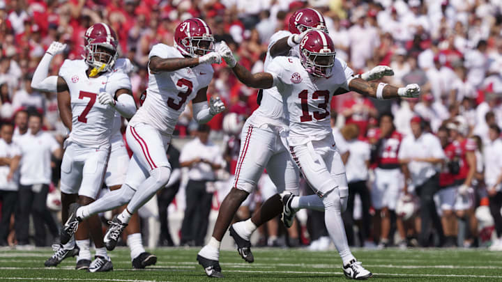 Sep 14, 2024; Madison, Wisconsin, USA;  Alabama Crimson Tide defensive back Malachi Moore (13) celebrates following a Wisconsin Badgers fumble during the second quarter at Camp Randall Stadium. Mandatory Credit: Jeff Hanisch-Imagn Images