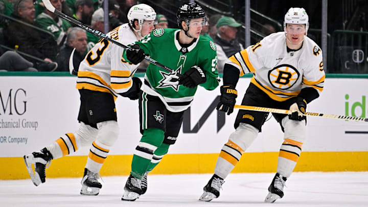 Jan 20, 2026; Dallas, Texas, USA; Dallas Stars center Wyatt Johnston (53) skates between Boston Bruins center Fraser Minten (93) and defenseman Nikita Zadorov (91) during the game at the American Airlines Center. Mandatory Credit: Jerome Miron-Imagn Images Jan 20, 2026; Dallas, Texas, USA; Dallas Stars center Wyatt Johnston (53) skates between Boston Bruins center Fraser Minten (93) and defenseman Nikita Zadorov (91) during the game at the American Airlines Center. Mandatory Credit: Jerome Miron-Imagn Images