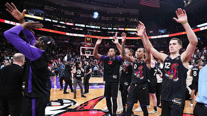 Apr 9, 2025; Toronto, Ontario, CAN; Toronto Raptors forward Scottie Barnes (4) and guard A.J. Lawson (0) acknowledge the crowd after a game against the Charlotte Hornets at Scotiabank Arena. Mandatory Credit: Nick Turchiaro-Imagn Images