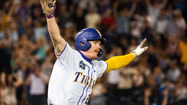 Jun 18, 2025; Omaha, Neb, USA; LSU Tigers first baseman Jared Jones (22) celebrates after hitting a walk off RBI single against the Arkansas Razorbacks during the ninth inning at Charles Schwab Field. 