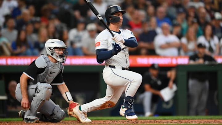Aug 5, 2025; Seattle, Washington, USA; Seattle Mariners second baseman Cole Young (2) hits a single against the Chicago White Sox during the fifth inning at T-Mobile Park. Mandatory Credit: Steven Bisig-Imagn Images