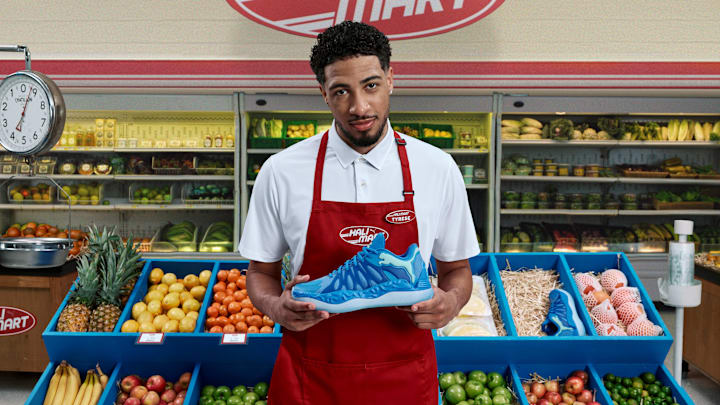 Tyrese Haliburton holds the PUMA Hali 1 'Opal' colorway.