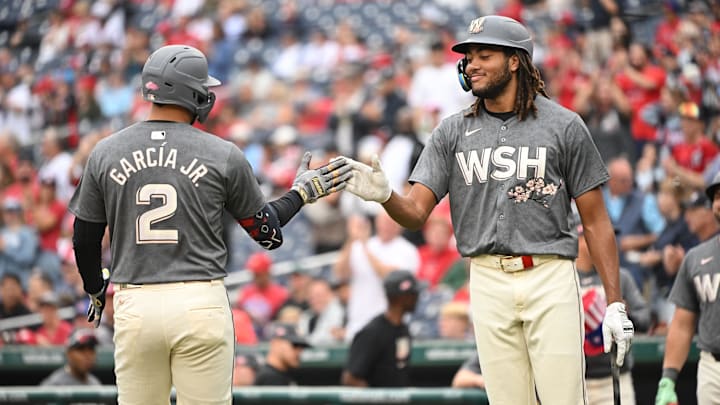 Sep 29, 2024; Washington, District of Columbia, USA; Washington Nationals second baseman Luis Garcia Jr. (2) celebrates at home plate with left fielder James Wood (29) after hitting a home run against the Philadelphia Phillies during the first inning at Nationals Park.