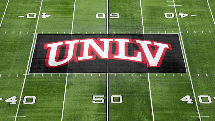 The UNLV Rebels logo at midfield during the Mountain West Championship at Allegiant Stadium. Mandatory Credit: Kirby Lee-Imagn Images The UNLV Rebels logo at midfield during the Mountain West Championship at Allegiant Stadium. Mandatory Credit: Kirby Lee-Imagn Images