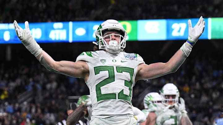 Dec 28, 2022; San Diego, CA, USA; Oregon Ducks wide receiver Chase Cota (23) celebrates after scoring a touchdown against the North Carolina Tar Heels during the second half of the 2022 Holiday Bowl at Petco Park. Mandatory Credit: Orlando Ramirez-Imagn Images Dec 28, 2022; San Diego, CA, USA; Oregon Ducks wide receiver Chase Cota (23) celebrates after scoring a touchdown against the North Carolina Tar Heels during the second half of the 2022 Holiday Bowl at Petco Park. Mandatory Credit: Orlando Ramirez-Imagn Images