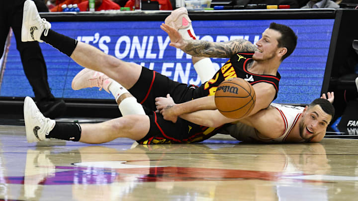 Jan 15, 2025; Chicago, Illinois, USA;    Atlanta Hawks guard Garrison Mathews (24) and Chicago Bulls guard Zach LaVine (8) chase as loose ball during the second half at the United Center. Mandatory Credit: Matt Marton-Imagn Images