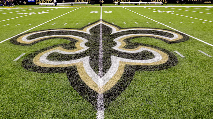 Oct 30, 2022; New Orleans, Louisiana, USA; General view of the New Orleans Saints logo as the midfield logo fleur-de-lis after the game between the New Orleans Saints and the Las Vegas Raiders at Caesars Superdome. Mandatory Credit: Stephen Lew-Imagn Images Oct 30, 2022; New Orleans, Louisiana, USA; General view of the New Orleans Saints logo as the midfield logo fleur-de-lis after the game between the New Orleans Saints and the Las Vegas Raiders at Caesars Superdome. Mandatory Credit: Stephen Lew-Imagn Images