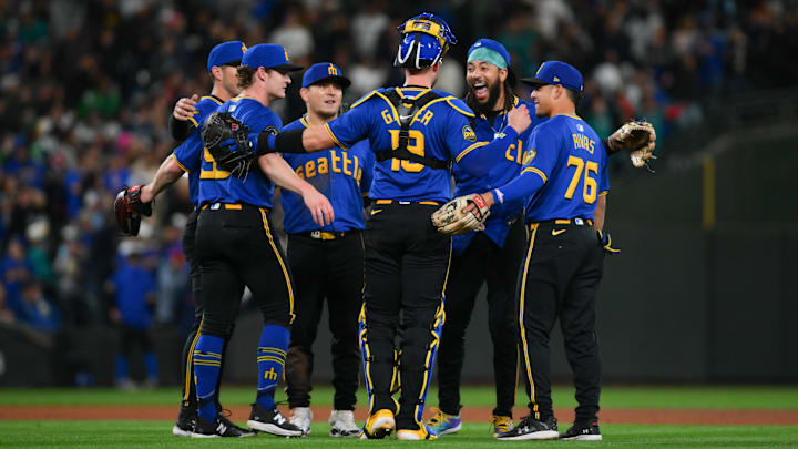 Sep 27, 2024; Seattle, Washington, USA; The Seattle Mariners celebrate defeating the Oakland Athletics at T-Mobile Park. Mandatory Credit: Steven Bisig-Imagn Images