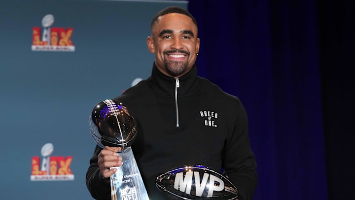 Feb 10, 2025; New Orleans, LA, USA; Philadelphia Eagles quarterback Jalen Hurts (1) poses with the Vince Lombardi trophy at the Super Bowl LIX Winning Head Coach and Most Valuable Player press conference at the Ernest N. Morial Convention Center. Mandatory Credit: Kirby Lee-Imagn Images Feb 10, 2025; New Orleans, LA, USA; Philadelphia Eagles quarterback Jalen Hurts (1) poses with the Vince Lombardi trophy at the Super Bowl LIX Winning Head Coach and Most Valuable Player press conference at the Ernest N. Morial Convention Center. Mandatory Credit: Kirby Lee-Imagn Images