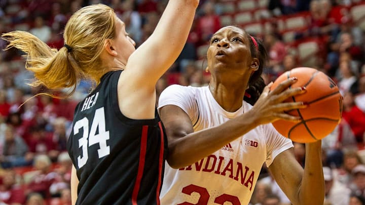 Indiana's Chloe Moore-McNeil (22) scores over Stanford's Tess Heal (34) during the Indiana versus Stanford women's basketball game at Simon Skjodt Assembly Hall on Sunday, Nov. 17, 2024.