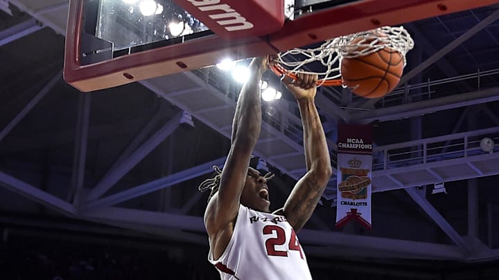 Arkansas Razorbacks guard Michael Qualls (24) dunks the ball against the LSU Tigers during the second half at Bud Walton Arena in Fayetteville, Ark.