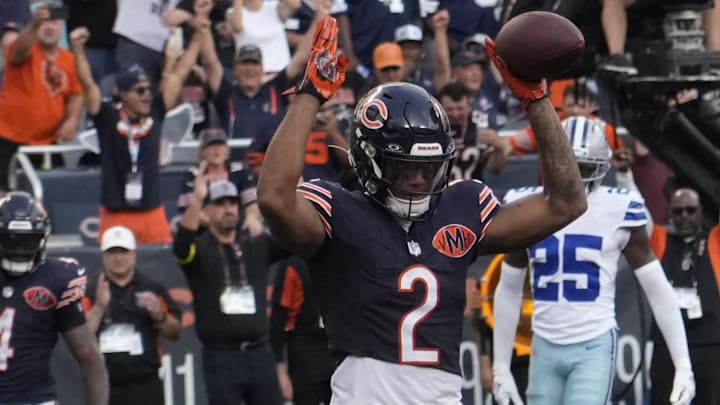 DJ Moore celebrates his TD catch on Caleb Williams' throw Sunday in a 31-14 Bears win over Dallas.