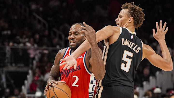 Dec 3, 2025; Atlanta, Georgia, USA; LA Clippers forward Kawhi Leonard (2) tries to get past Atlanta Hawks guard Dyson Daniels (5) during the second half at State Farm Arena. Mandatory Credit: Dale Zanine-Imagn Images