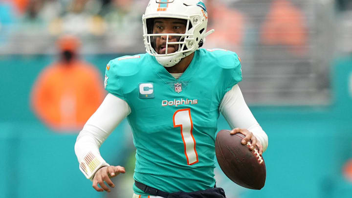 Dec 25, 2022; Miami Gardens, Florida, USA; Miami Dolphins quarterback Tua Tagovailoa (1) scrambles