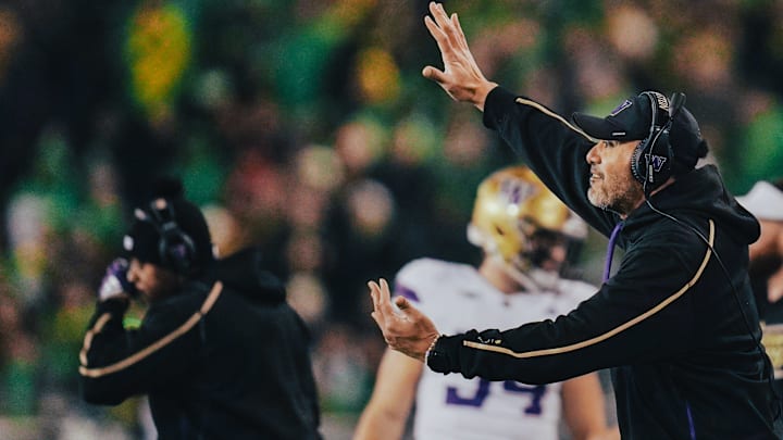DL coach Jason Kaufusi directs traffic from the Husky sideline at Oregon. DL coach Jason Kaufusi directs traffic from the Husky sideline at Oregon.