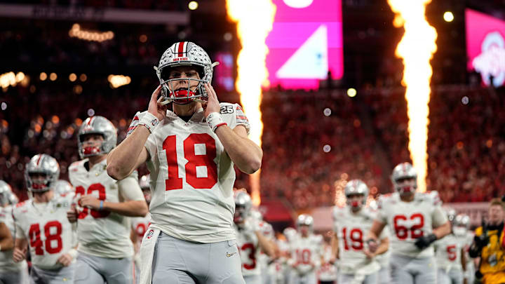 Ohio State Buckeyes quarterback Will Howard (18) take the field for the start of the game against Notre Dame Fighting Irish during the College Football Playoff National Championship at Mercedes-Benz Stadium in Atlanta on January 20, 2025.