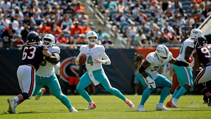 Miami Dolphins quarterback Reid Sinnett (4) looks to pass the ball against the Chicago Bears during the second half at Soldier Field in the 2021 preseason.
