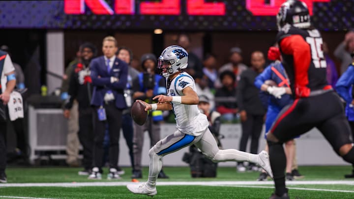 Jan 5, 2025; Atlanta, Georgia, USA; Carolina Panthers quarterback Bryce Young (9) runs the ball for a touchdown against the Atlanta Falcons in the fourth quarter at Mercedes-Benz Stadium. Mandatory Credit: Brett Davis-Imagn Images Jan 5, 2025; Atlanta, Georgia, USA; Carolina Panthers quarterback Bryce Young (9) runs the ball for a touchdown against the Atlanta Falcons in the fourth quarter at Mercedes-Benz Stadium. Mandatory Credit: Brett Davis-Imagn Images