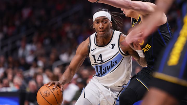 Mar 22, 2025; Atlanta, Georgia, USA; Atlanta Hawks guard Terance Mann (14) drives to the basket against the Golden State Warriors in the first quarter at State Farm Arena. Mandatory Credit: Brett Davis-Imagn Images